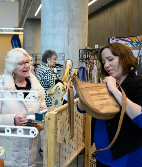 Delegates shop at a local pop-up market in the Halifax Convention Centre atrium