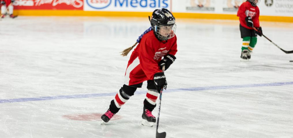 Young player skates on ice