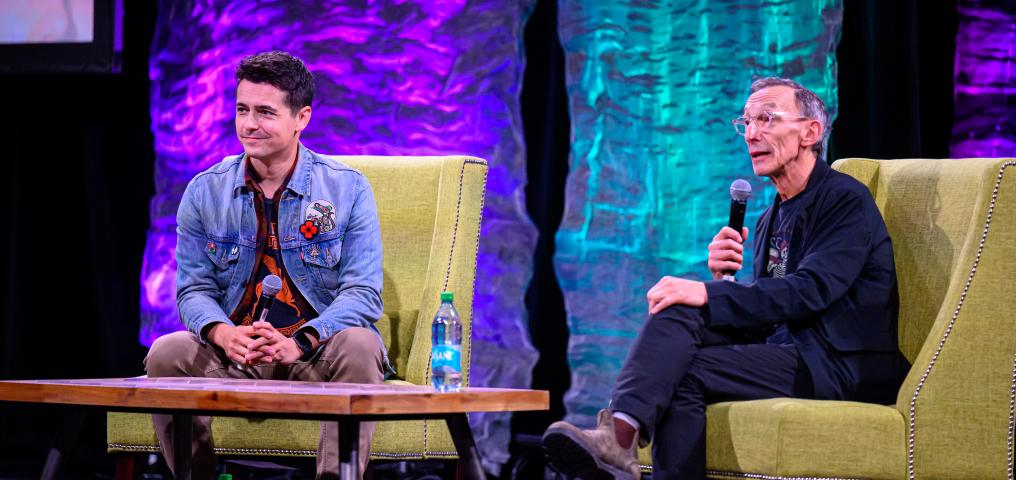 Tanner Zipchen and guest Julian Richings sit onstage during a panel discussion