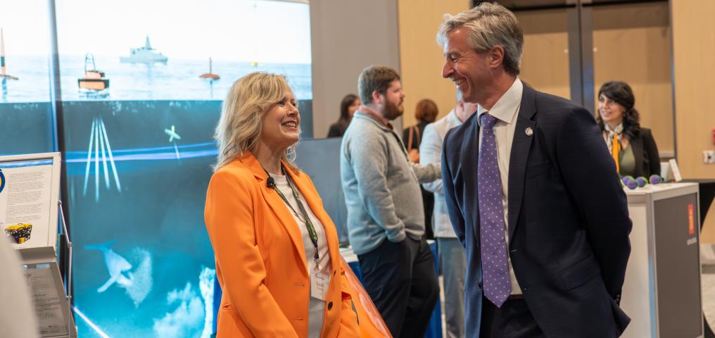 Premier of Nova Scotia Tim Houston talking with a guest of the H2O Conference